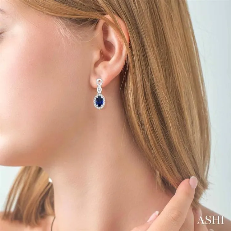 5x3 MM Oval Cut Sapphire and 1/6 ctw Round Cut Diamond Earrings in 10K White Gold
