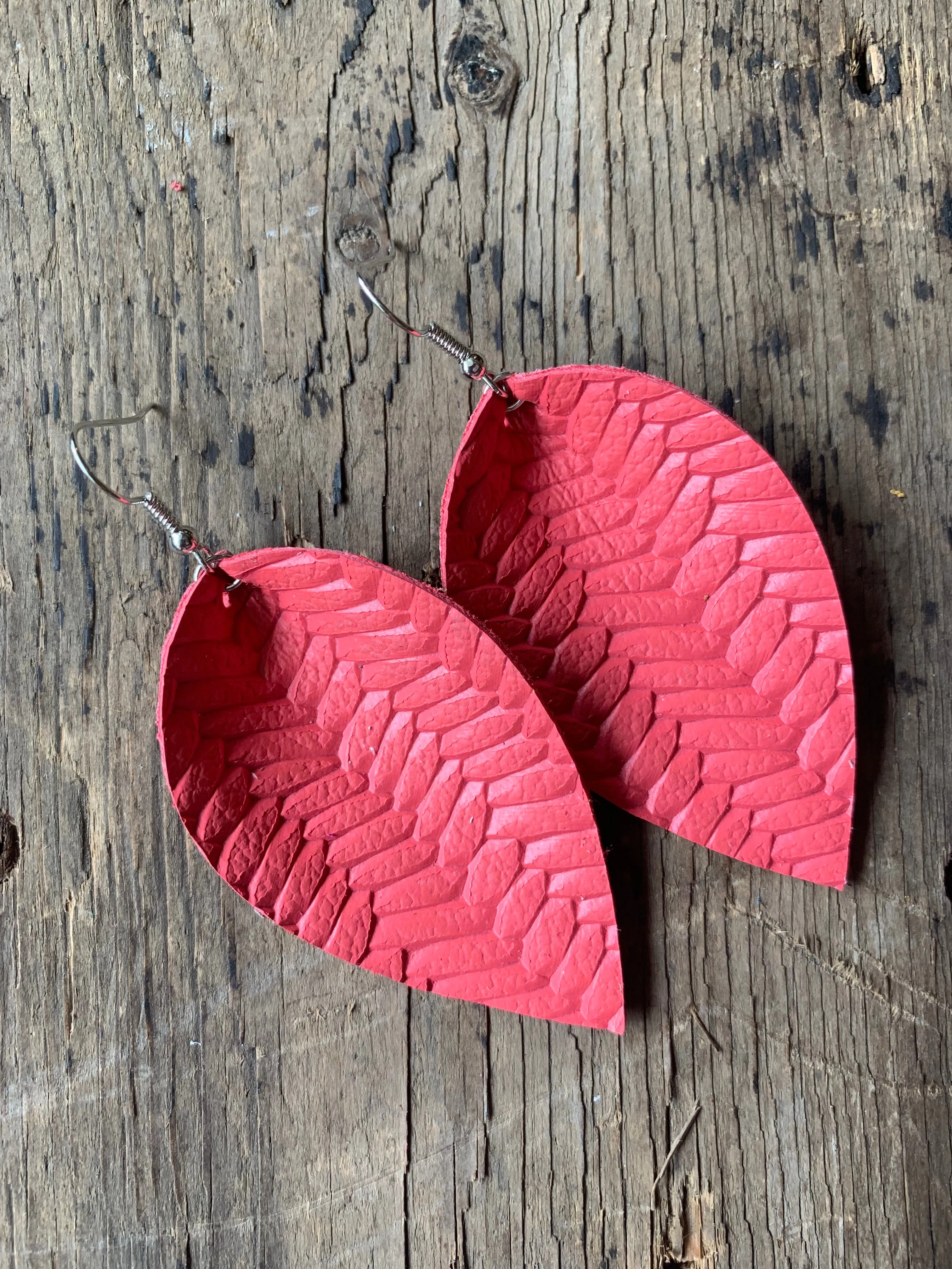 Coral braided leather earrings