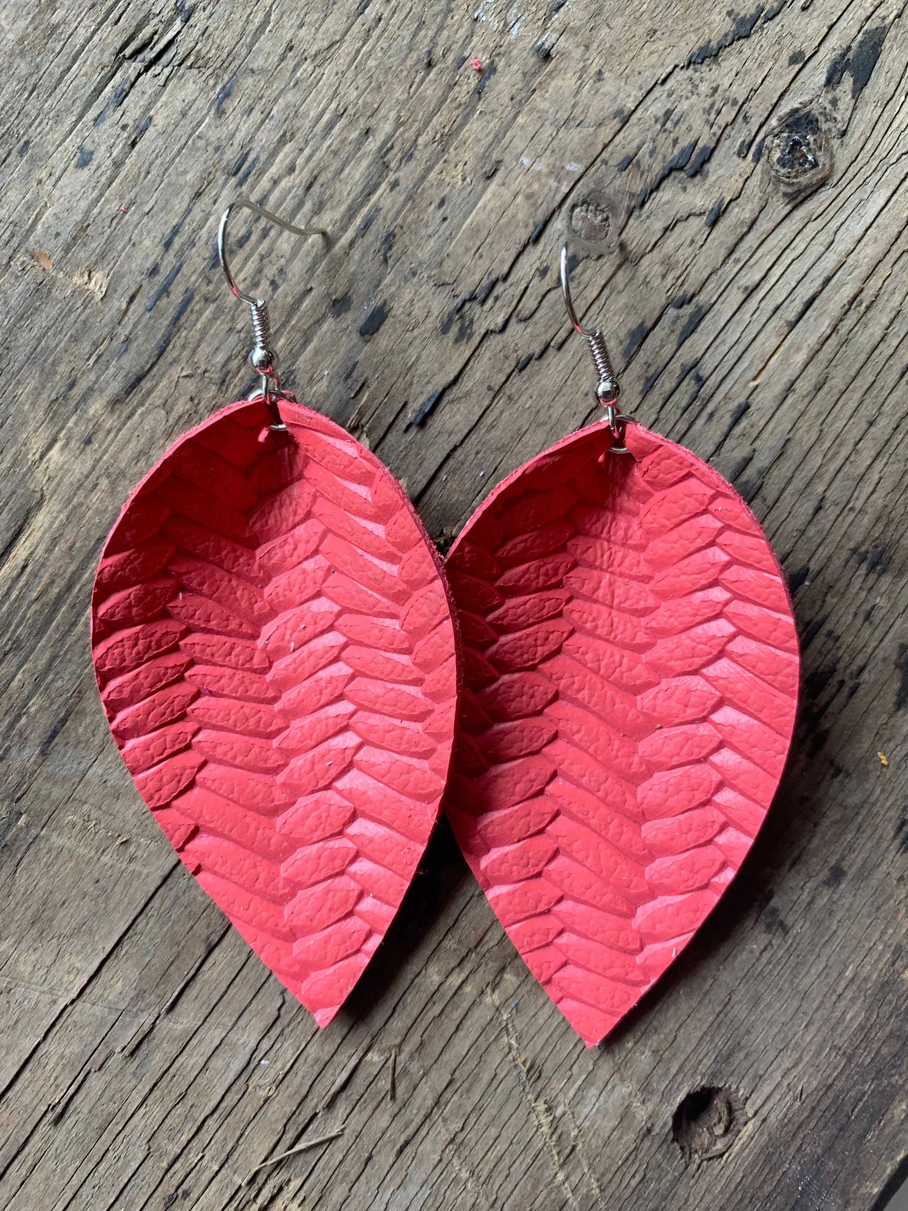 Coral braided leather earrings
