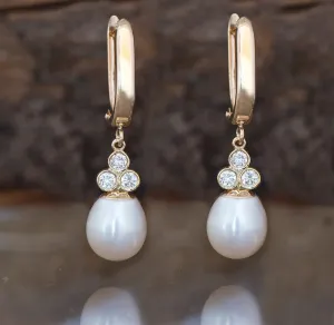 Pearl dangle earrings with diamonds
