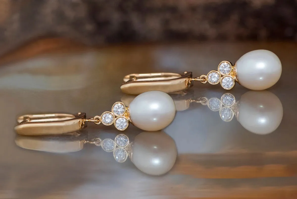 Pearl dangle earrings with diamonds
