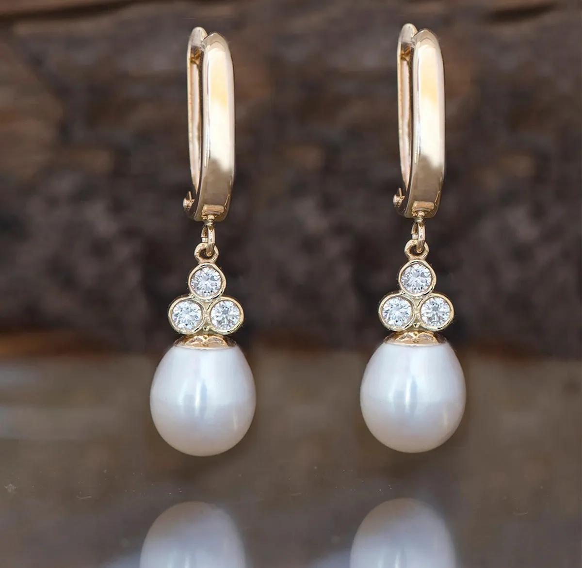 Pearl dangle earrings with diamonds
