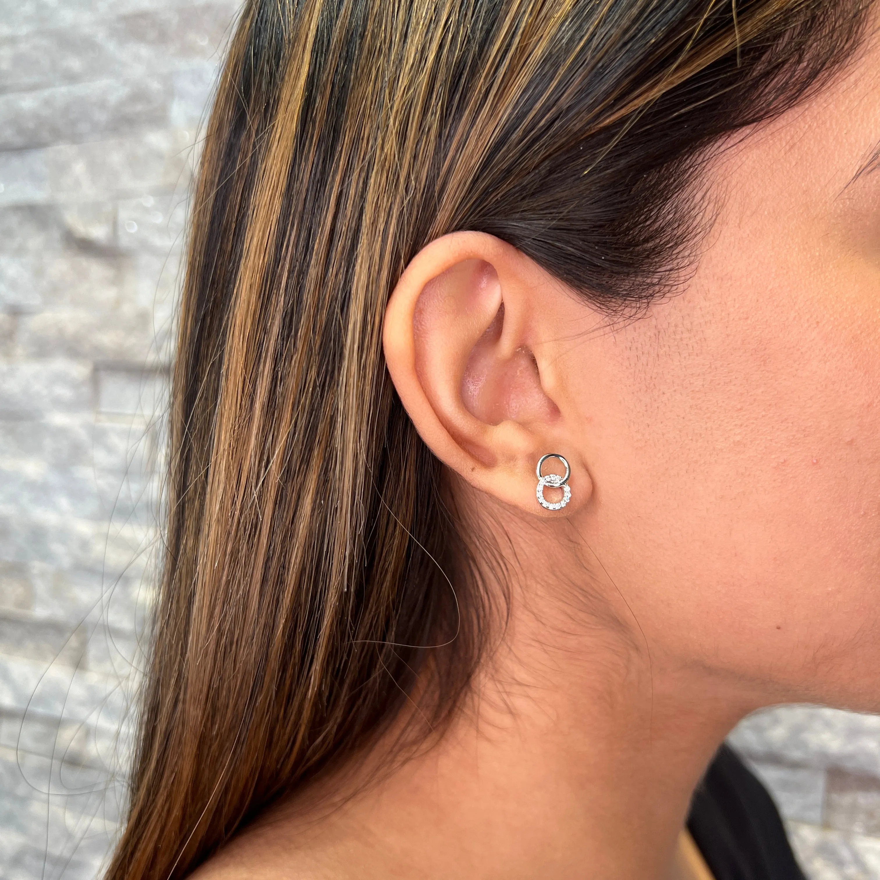 Reign Sterling Silver Rhodium Plated CZ Interlocking Circle Stud Earrings