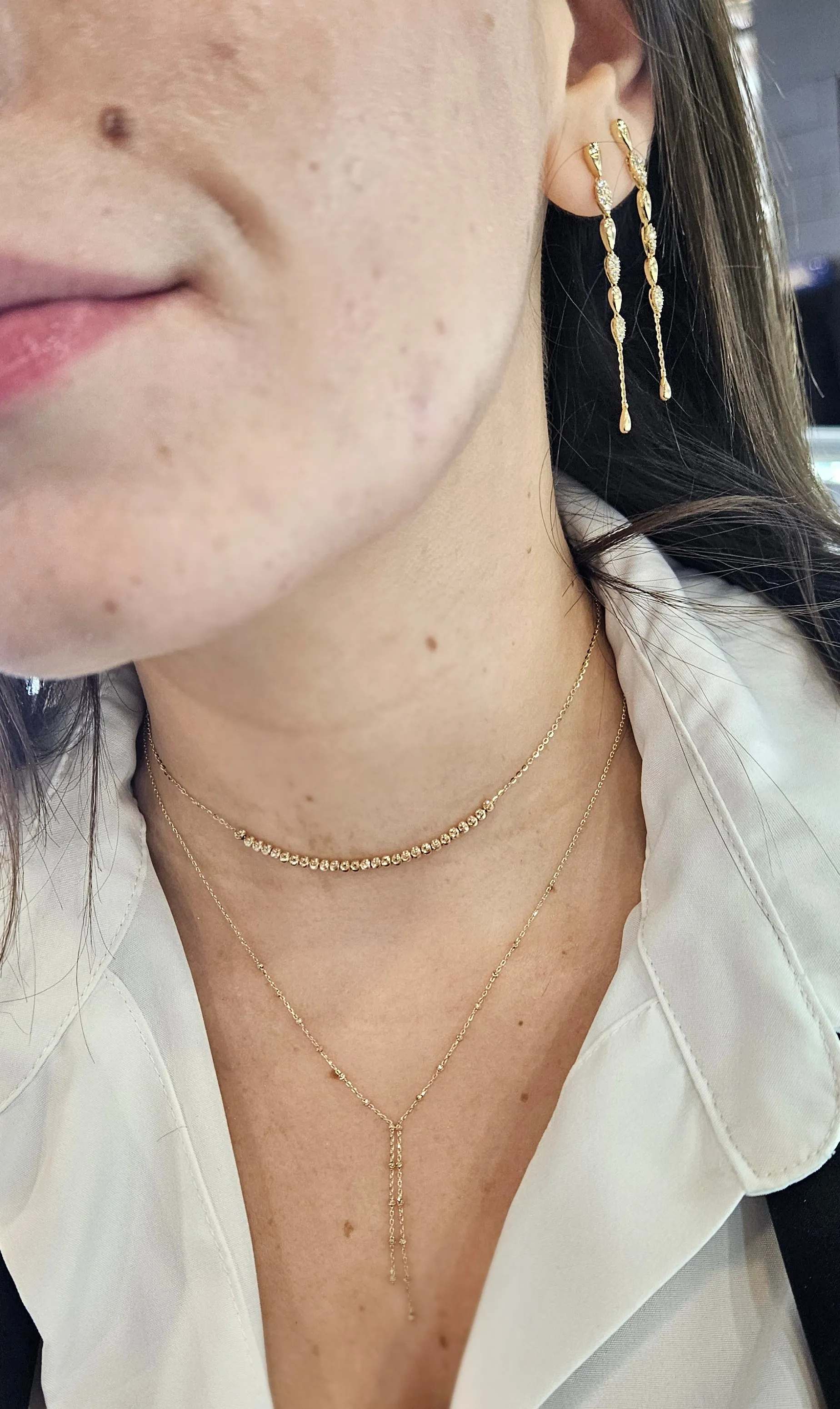 Stationed Gold And Diamonds Teardrop Dangle Earrings