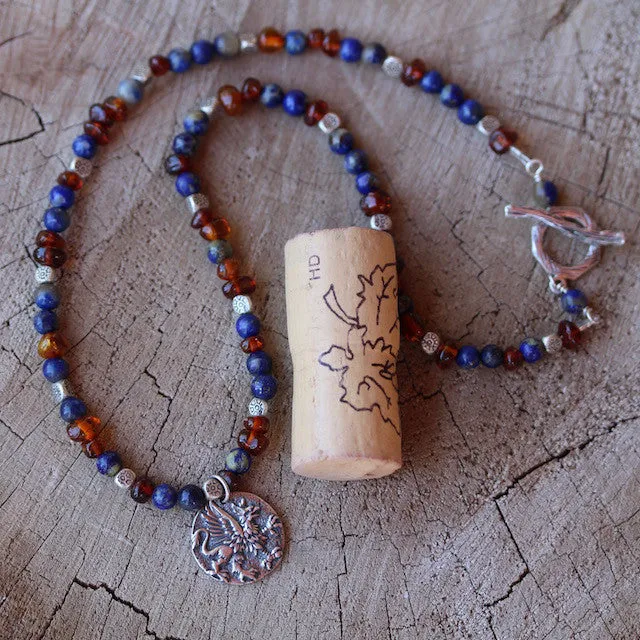 Sterling griffin pendant necklace with lapis and amber