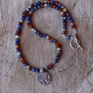 Sterling griffin pendant necklace with lapis and amber