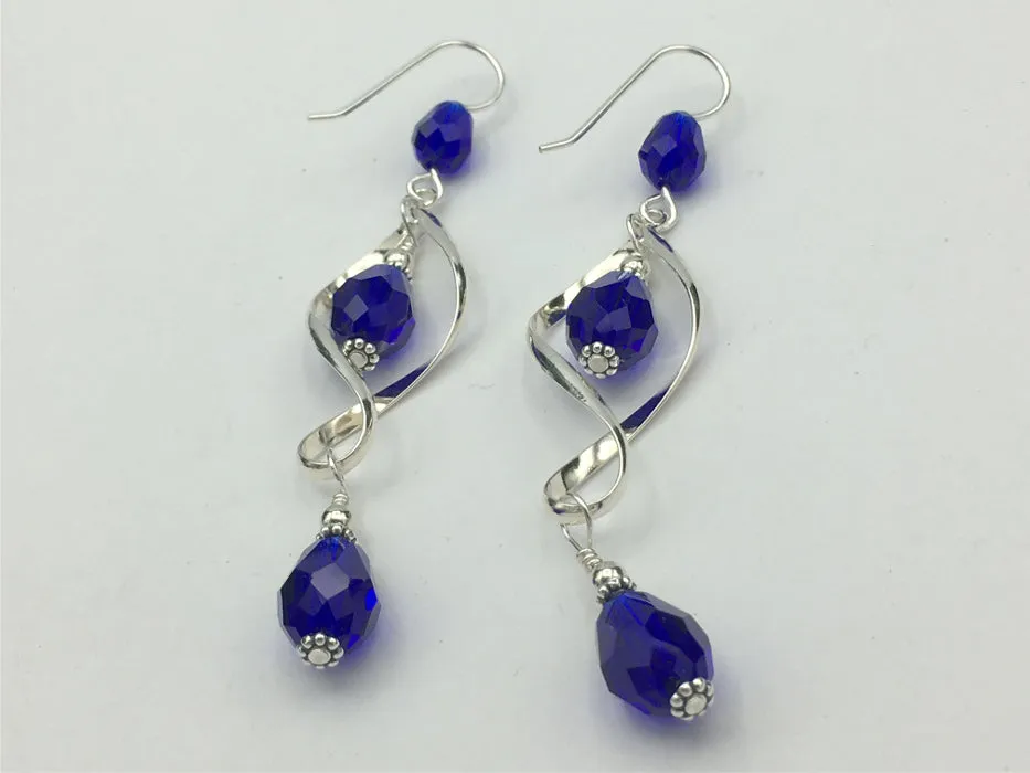 Sterling Silver long open twist drop Earrings- Celtic Knot, cobalt blue crystal