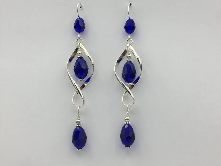 Sterling Silver long open twist drop Earrings- Celtic Knot, cobalt blue crystal