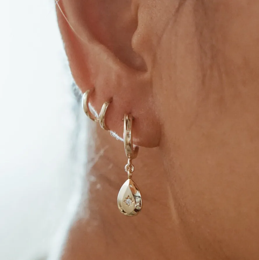 Teardrop North Star CZ Huggie Earrings