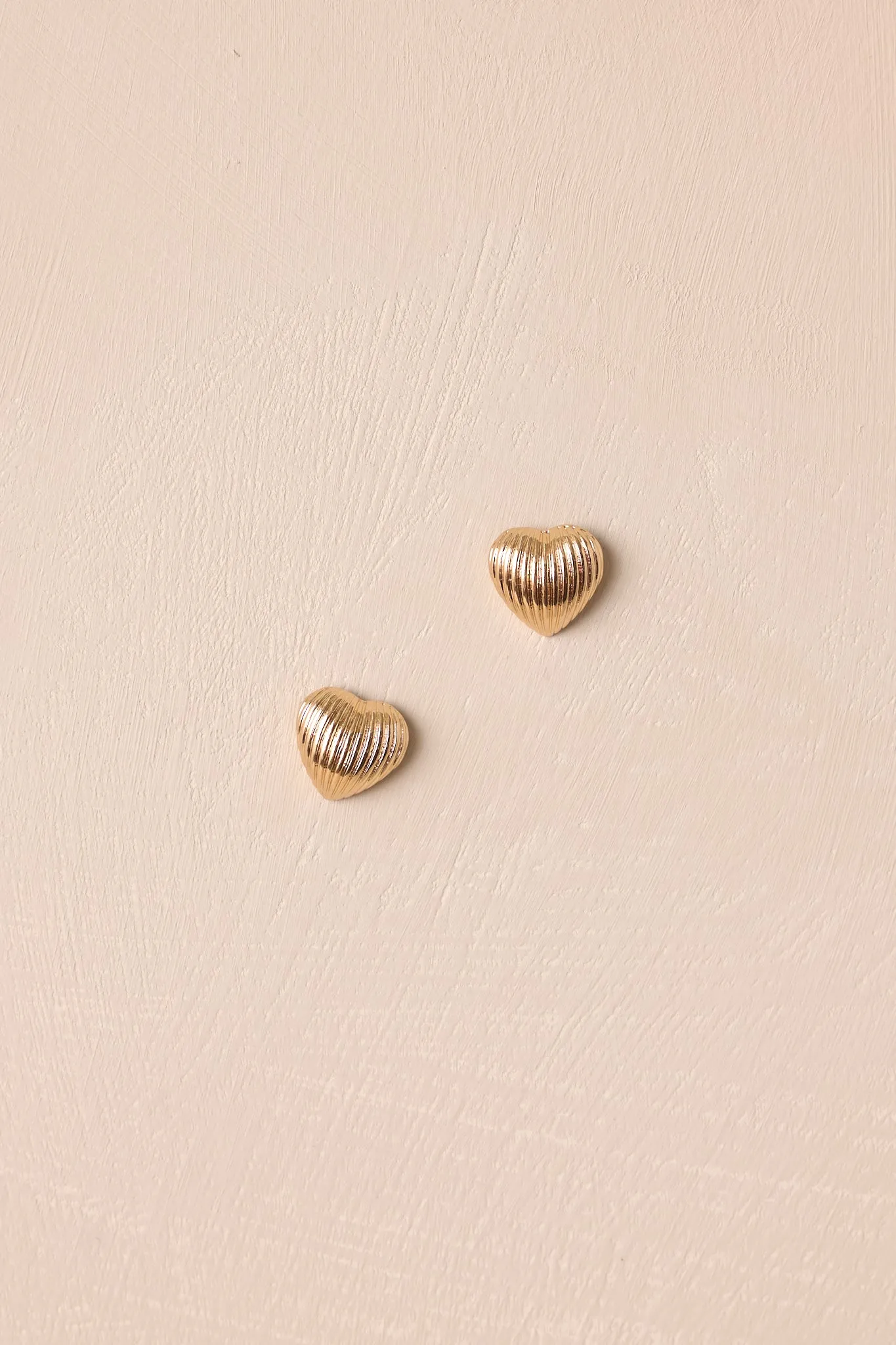 The Whispering Chasm Gold Textured Heart Earrings